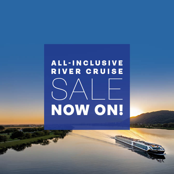 White 'all-inclusive river cruise sale now on' text in a purple square overlaid on an image of Spirit of the Danube sailing at sunset